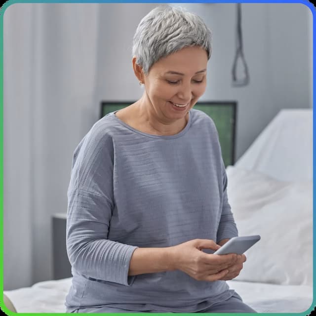 Woman reading electronic discharge instructions from her phone. 
